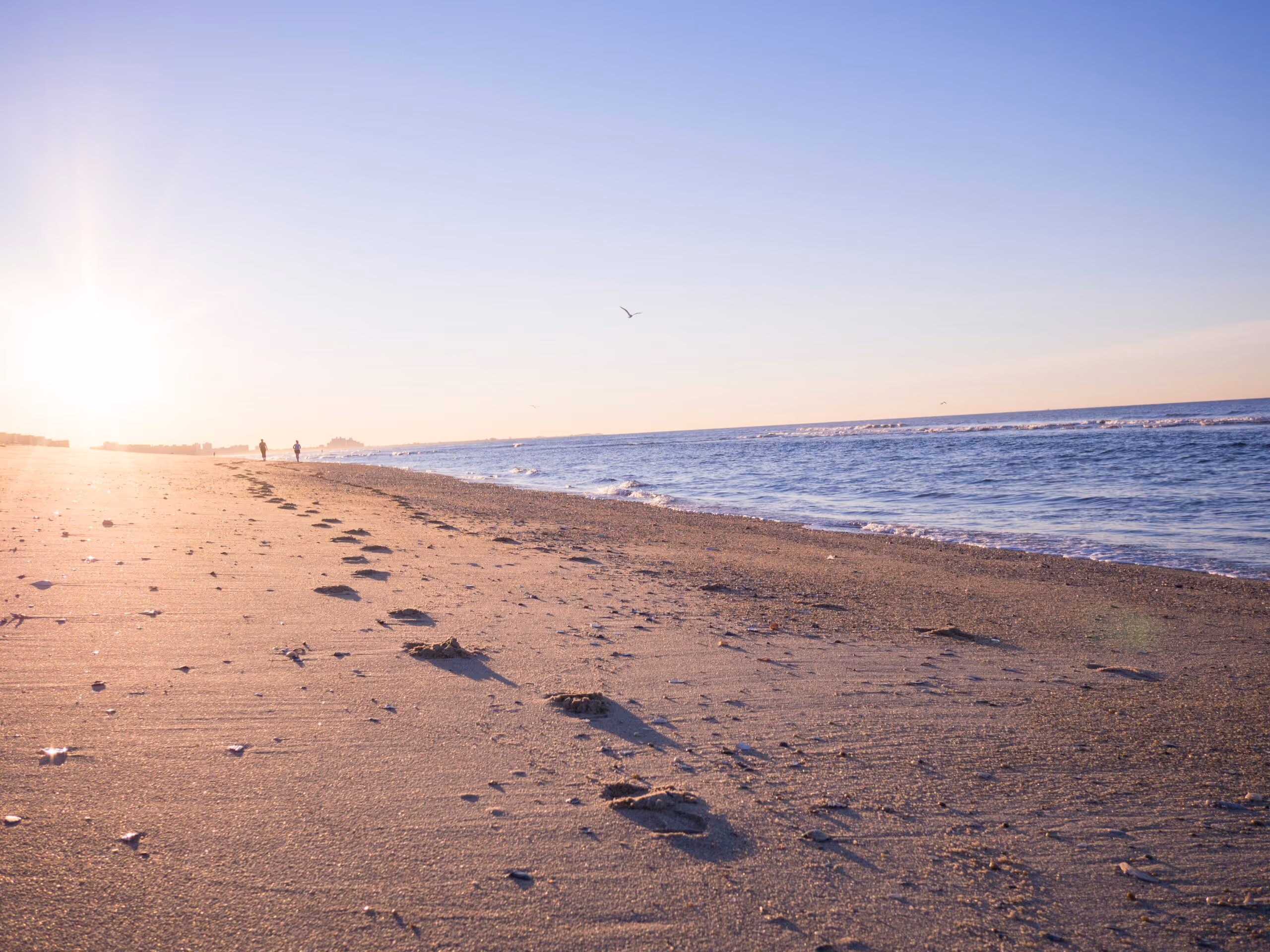 Photo of footsteps on a beach - depicting counselling being one step at a time